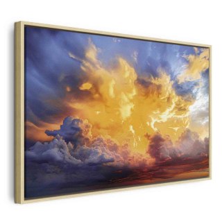 Obraz - Piękny zachód słońca - chmury w ciepłych odcieniach 90x60 W ramie drewnianej naturalnej