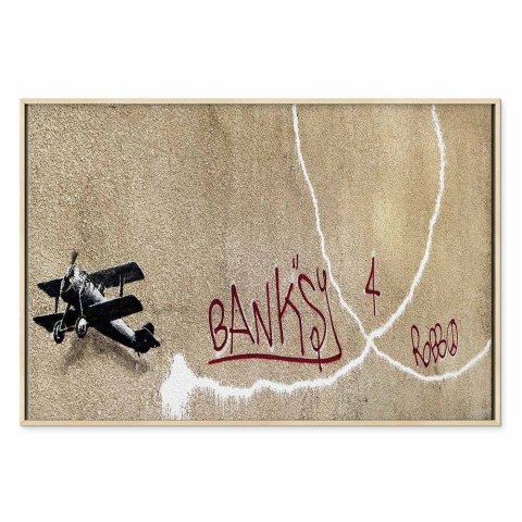 Obraz - Samolot Banksy (1-częściowy) - graffiti czerwone napisy na tle muralu 120x80 W ramie drewnianej naturalnej