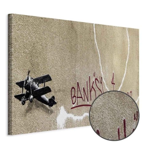 Obraz - Samolot Banksy (1-częściowy) - graffiti czerwone napisy na tle muralu 30x20 Premium Print