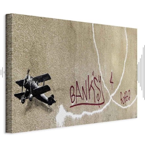 Obraz - Samolot Banksy (1-częściowy) - graffiti czerwone napisy na tle muralu 90x60 Akustyczny