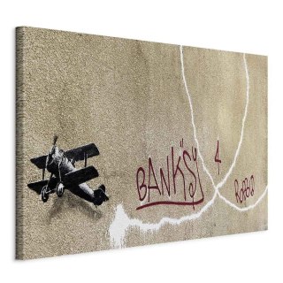 Obraz - Samolot Banksy (1-częściowy) - graffiti czerwone napisy na tle muralu 90x60 Na płótnie włoskim