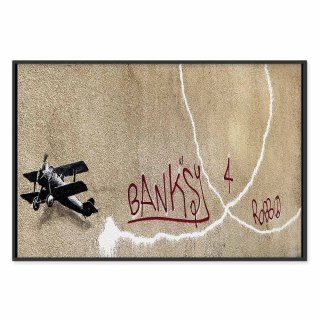 Obraz - Samolot Banksy (1-częściowy) - graffiti czerwone napisy na tle muralu 90x60 W ramie drewnianej czarnej